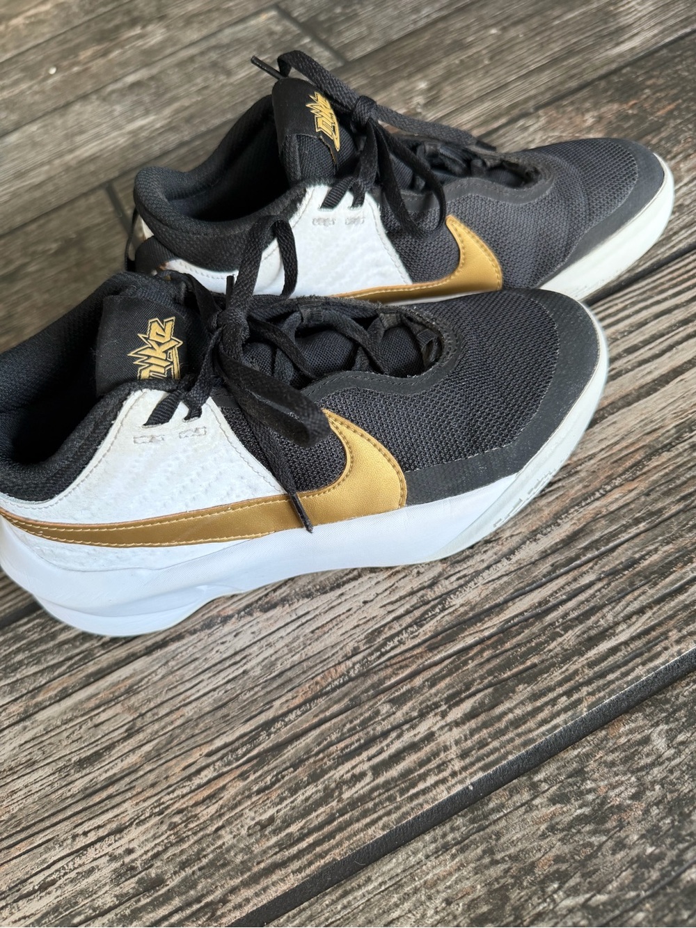 Nike Team Hustle Black, White & Gold Athletic Low-Tops